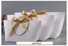 Boîte présente en or pour pyjamas Livres de vêtements emballages Gold Handle Paper Box Box Kraft Paper Large taille sac avec poignées décor4721452