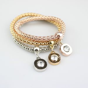 Bracelet de rose d'or Bangle de bracelet 3pcs / Set ethnique bracelets de charme rond avec pendentifs élastiques femmes