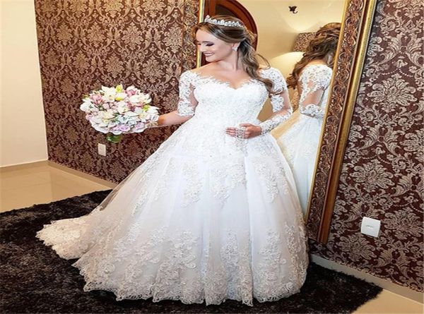 Magnifique robes de mariée en dentelle transparente creux arrière à manches longues une ligne prres des robes nuptiales royales balayent les vestidos de sentier de noiv4130292