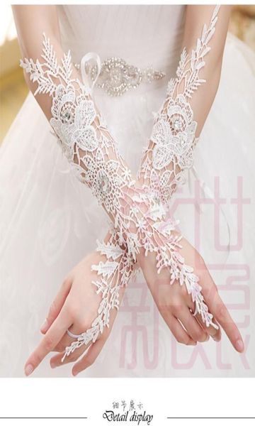 Magnifique luxe Ivory Elbow Longueur sans doigt Gants de mariée appliqués dentelle Gants de mariage longs avec cristaux4255105