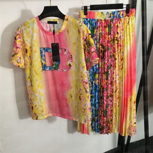 GRADIENT BLOEM Gedrukt T -shirt Geplooide jurk 2 stks Sets Tweedelig dames Designer Letter Letter Korte mouw T -rokken tweewaardig