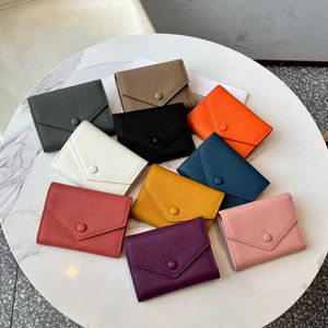 Guangzhou portefeuille femmes 2024 nouveau cuir véritable 30% pince à billets couche peau de vache porte-monnaie polyvalent à la mode Style court petit sac à cartes sacs à main vente