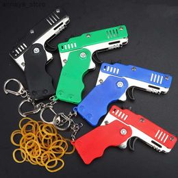 Pistolet toys 1pcs mini métal arme pliant pliant jouet jouet en plein air sport keychain jouet 6 éclats de pistolet en caoutchouc kid gifts fête faveur pistolet toysl2404