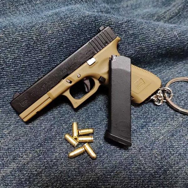 Pistolet toys nouvel empire g17 g34 pistolet modèle shell ejection 1 3 mini pistolet keychain métal metal faux pistolet with holster t240428