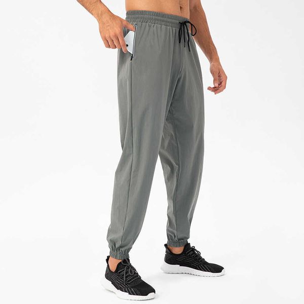 Leggings de gimnasia Trajes de yoga para hombres Pantalones deportivos sueltos Pape de bolsillo impermeable de bolsillo Pantal