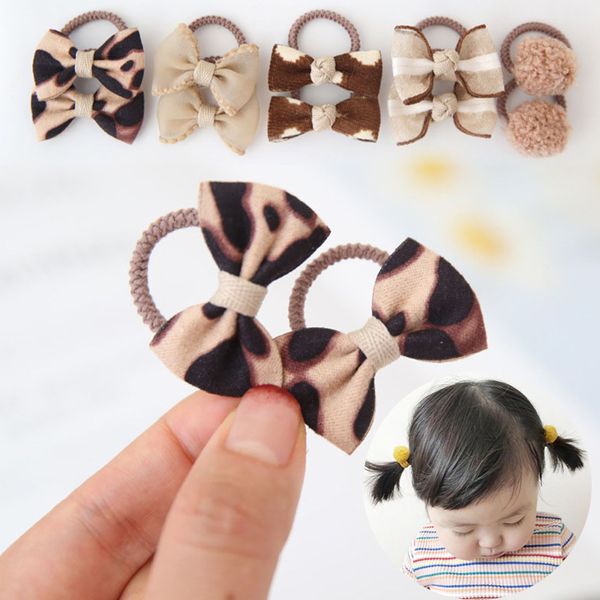 Accessoires pour cheveux 10PcsLot mignon léopard arcs bébé bande fleur treillis imprimer filles corde Mini pompon élastiques enfants 230328