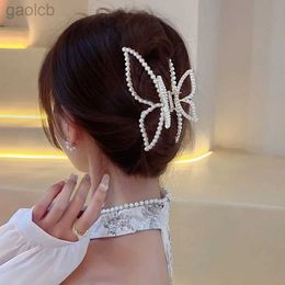 Haarclips Bruiltes Simple en Stijlvolle boog Pearl Haar Klauwen Haaraccessoires Metaal Grab Haar Clip Shark Clip Perse Tail Claw Clip Woman Hair Clip 240426