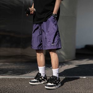 Han Lu Mens Metal Texture Texture Beach Shorts pour l'été Nouveau pantalon fendu décontracté à jambe droite polyvalente brodée