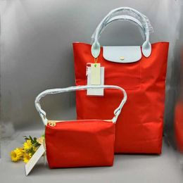 Détail de sac à main portefeuilles en gros de vente en gros sacoche bolso de haute qualité en nylon vertical de blocage de couleur d'épissage sac pour boulet