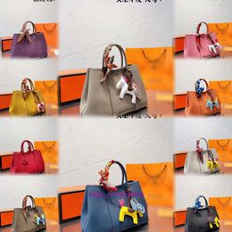 Bolso de mano de cuero genuino para mujer Liaoning Anshan Nantai promoción de liquidación de exportación bolso de jardín compras