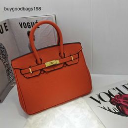 Sac à main fait à la main 7a Texture Premium Womens Handbag 25 cm en cuir souple à la mode togo exquis et polyvalent ont un logo