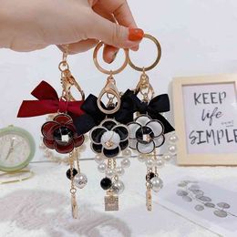 Handgemaakte DIY Craft Rhinestone Pearl Mountain CamelliaKeychain Schattige tas Charm Holder Cartoon Resin Sleutelhanger Whole