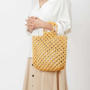 Handgemaakte geweven handtas voor dames zomer niche-ontwerp, uitgeholde houten kralentas voor woon-werkverkeer voor dames