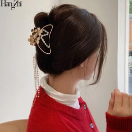 HangZhi 2021 fée creux papillon fleur à la main perle chaîne longue gland cheveux griffe côté pince pour femmes accessoires Clips Barrettes