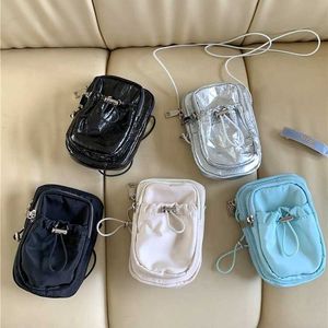 HBP No nuevo estilo Bolso cruzado simple para mujer Tela de nailon resistente al agua Cremallera mini teléfono PU Cordón Volantes bandolera pequeña