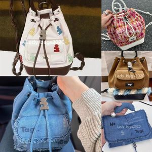 Sac à dos de sac TAGI Sacs de marque Luxury Backage de vache tressé Pocket Pocket Pearl Bucket Mini Femme DrawString Travel Racs Purse Backpacks Crossbodybag