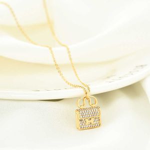Hij ketting dure ontwerpbetrokkenheid ketting mode goud ingelegde handtas modeketen vrouwelijke sieraden met originele logo axiv