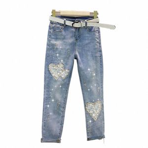 Heart Lace Cut Out Jeans para mujer 2022 Primavera Verano Elástico Slim Hot Drill Lápiz Pantalones Ladies Street Denim Pantalones Pantalones femeninos C6V5 #