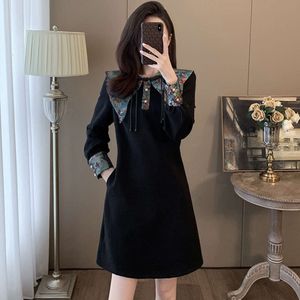 Robe de style chinois haut de gamme pour femme en automne et hiver, ligne A taille haute à la mode, superbe et super belle, avec un tempérament de petite jupe noire.