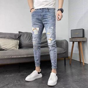 Trous de broderie haut de gamme lavés pour faire de vieux jeans hommes version coréenne coupe slim petits pieds tendance décontractée pantalon long micro élastique 15