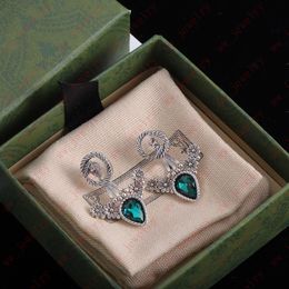 Hoogwaardige smaragdgroene bloemoorbellen, oude zilveren twee-slijtagemethode kan smaragdgroene oorbellen, elegante vrouwen, banket, geschenken worden verwijderd