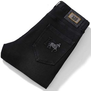 High-end Europese herfst Black Cotton Elastische jeans heren kleine voeten Koreaanse mode veelzijdige witte broek