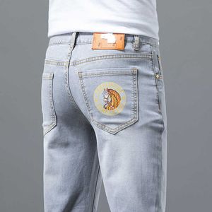 High-end Europese heren bijgesneden jeans zomer dunne en trendy casual slanke fit elastisch digitaal printen borduurwerk