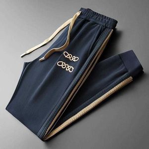 Pantalon pour hommes haut de gamme pantalon de créateur au crayon à lacets d'automne pantalon décontracté masculine femme à rayures jacquard pantalon tricoté extérieur pantalon lâche