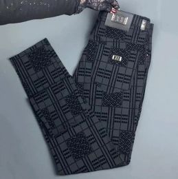 Pantalones casuales flocados de seda de hielo de alta calidad para hombres en verano, pantalones de negocios finos y lujosos de estilo europeo, pantalones de pierna recta versátiles y ajustados