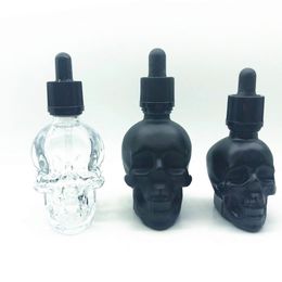 Alta calidad 30ml 60ml Mate Negro Cabeza de calavera Botella de aceite para el cabello Botella de aceite corporal con tapa a prueba de manipulaciones Por Sea ToDoor Botella con cuentagotas de calavera