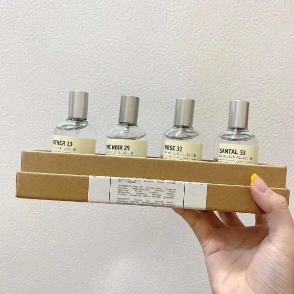 Paquete de marcas de alta calidad Perfume unisex Mujeres Hombres Sabor natural Sabor a madera Fragancias de perfume femeninas 4X30 ml (13-29-31-33)