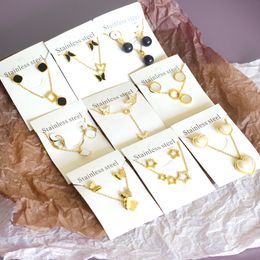 Hoge kwaliteit goedkoop merk Dubai vergulde roestvrijstalen hanger ketting oorbellen sieraden set voor vrouwen
