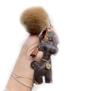 Haute qualité porte-clés mode clé boucle sac à main pendentif sacs chien Style conception sac poupée chaînes clés boucles 19 couleur