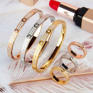 Conjunto de joyería de alta calidad para mujer, accesorios con incrustaciones de diamantes, hermosa pulsera de anillo de oro galvanizado de acero inoxidable para mujer