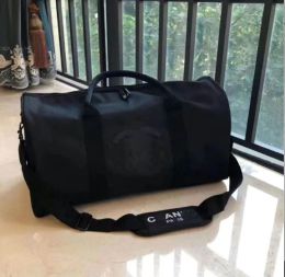 Bolsos de lona de moda de moda de alta calidad Bolsos de equipaje de diseño de la marca Mujeres de la marca Bolsas de gran capacidad Duffel Bag 45*25-21cm