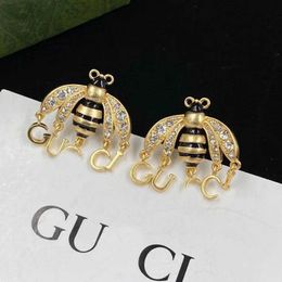 Bijoux de luxe de haute qualité petite colle d'abeille laissant tomber la conception de strass boucles d'oreilles aiguille en argent français