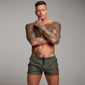 Haute qualité séchage rapide hommes Shorts été plage mode poche fermeture éclair musculation Fitness pantalons courts gymnases survêtement Shorts 210421