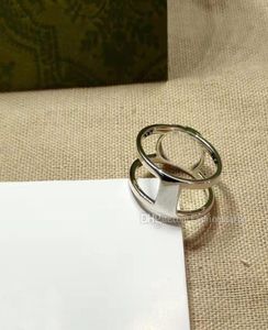 Diseñador de anillos de alta calidad Anillos de lujo para mujeres Joyas Bilaterales Huecos G Men039s Titanium Aleación de acero Partido de plata G7367038