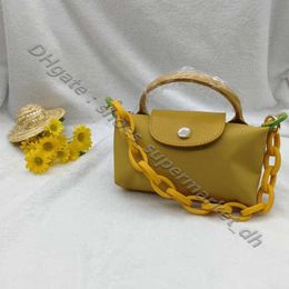 Color de mango de billetera pequeña de alta calidad High 2024 Single Quals The Lady Cognac Mini Summer Beach Bag Bags Bolsas para computadoras portátiles de cuero Paquete de albóndigas de lujo