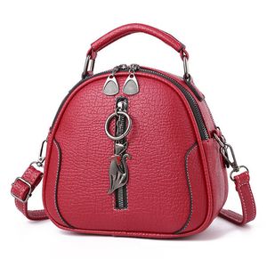 Hoogwaardige solide pu lederen mode dames tas dames crossebody messenger schoudertassen vintage handtassen kitten ornamenten luxehandbags555