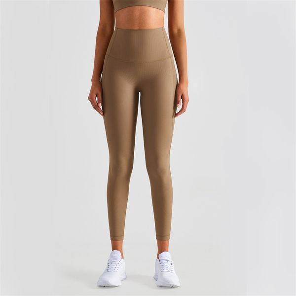 Collants taille haute Pantalon de yoga de couleur unie sans ligne en T Leggings élastiques sensation nue Pantalon de survêtement avec poches à la taille Pantalon de fitness pour femme Classique serré