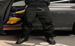 Pantalons de cargaison imprimés rétro de High Street Mens Hip Hop Multipockets décontractés droits Saut-salles en vrac surdimensionnées Couple Jogger 227957072
