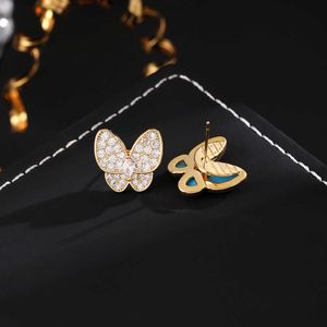 Tempérament polyvalent haut de gamme à la mode haut de gamme Boucles d'oreilles Van Butterfly Femmes Asymétriques Blue Email Full Diamond Bijoux