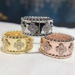 Versión alta de cuatro hojas Anillo de caleidoscopio para mujeres con revestimiento de oro rosa, versión ancha y estrecha, una fila de diamantes con anillos de estrellas de cielo completo