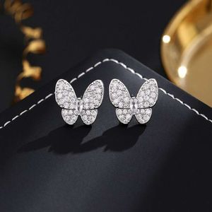 Version haute aiguille sier + Butterfly de fanjia électroplate en or authentique avec boucles d'oreilles super immortelles en diamant complet