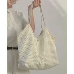 Bolsos de hombro de cadera Bolso tejido Bolsos de diseñador para mujer Tote de moda Versátil Estudiante Aula Bolso de gran capacidad 240311