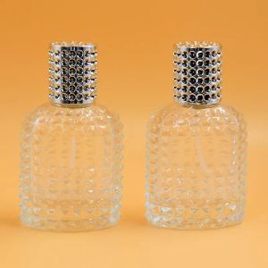 Hot 2019 30ml 50ml Perfume Bouteille vide Verre transparente Verbe flotte de pulvérisation avec les couvercles en argent en or en stocks LL