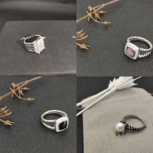 Hot créateur vendant des anneaux de bande de dy torsadés à deux couleurs croix perles ring
