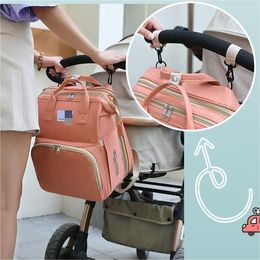 Bolsa de mamá de alta calidad, mochila portátil para cama de bebé plegable, bolsa multifuncional para madre e hijo, bolsa de diseño de lujo para mujer