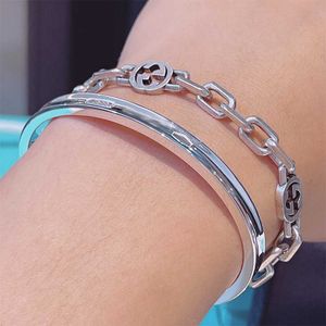 Hot plukken tff dezelfde stijl mannelijk en vrouwelijk paar titanium stalen armband tff luxe klassieke eenvoudige sieraden open armband